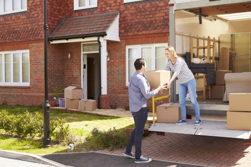 Professional movers loading furniture for a Kingston upon Thames home move