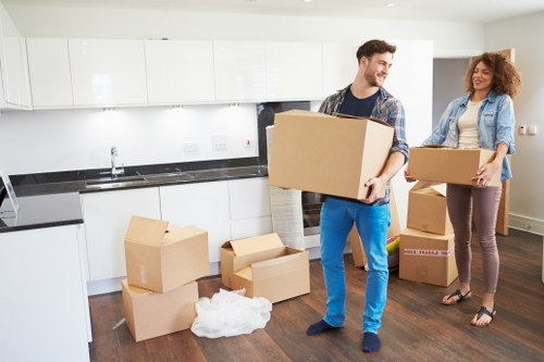 Careful loading of wardrobes and tables during a Kingston furniture pick-up