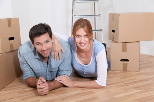 Packed moving boxes and furniture ready for transport in Kingston