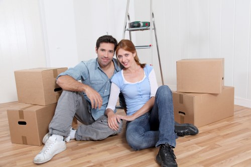 Furniture and boxes being loaded into a moving van in Kingston