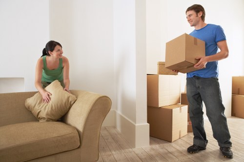 Removal team carrying boxes during a local move in Kingston upon Thames